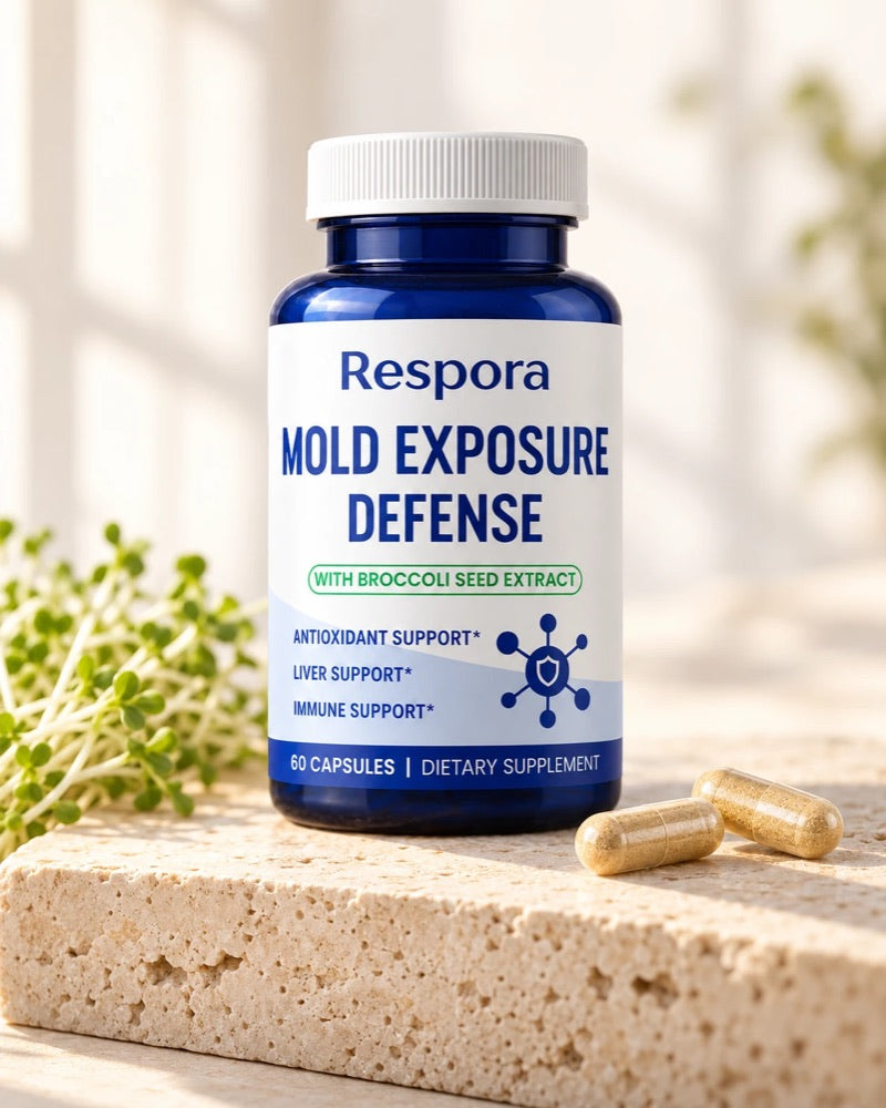A bottle of Respora Mold Exposure Defense with two capsules on a stone block